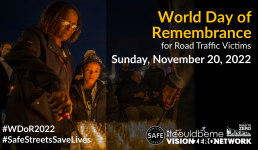 A graphic with people looking somber and holding candles it reads World Day of Remembrance in bold yellow text. in white text" for road traffic victims" in white bold text November 20, 2022